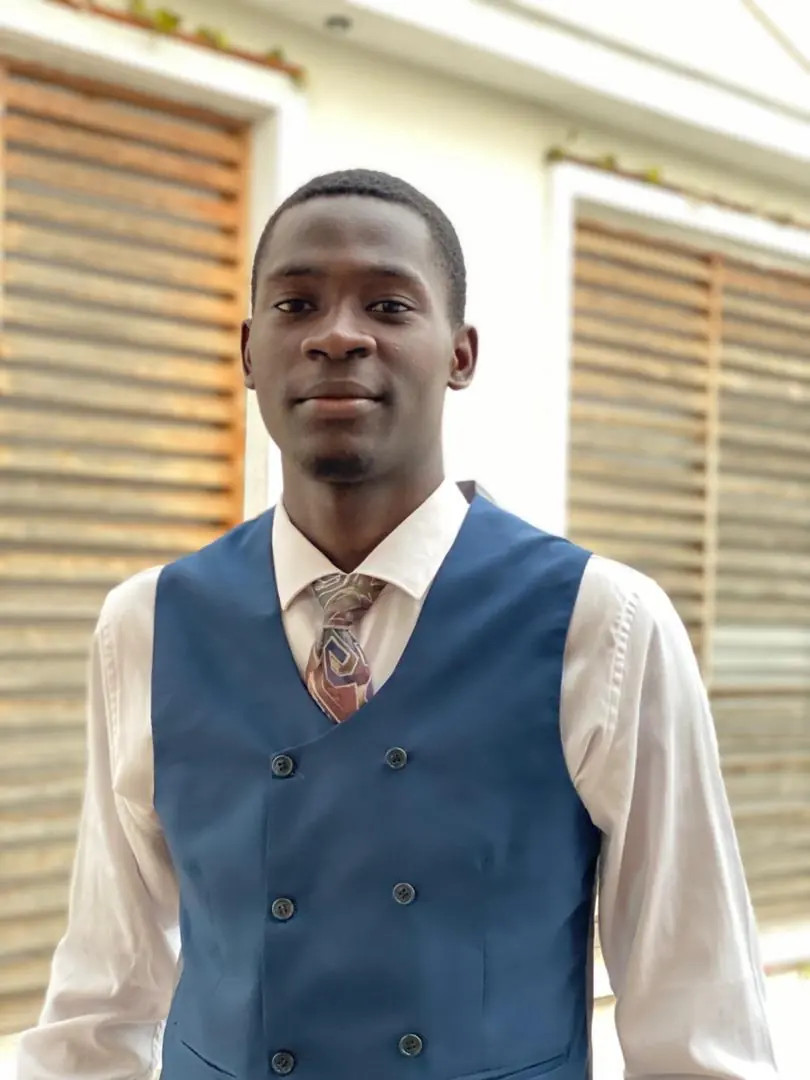 Portrait of Olabisi Adigun in a blue waistcoat